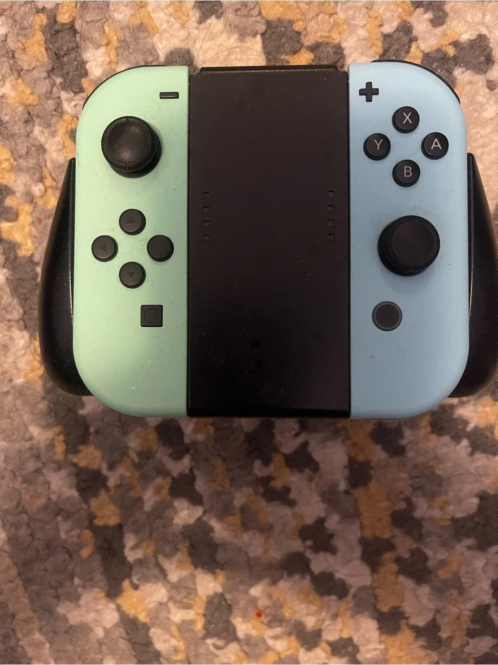 Nintendo Switch with Yellow Left Joy‑Con and Mint Right Joy‑Con